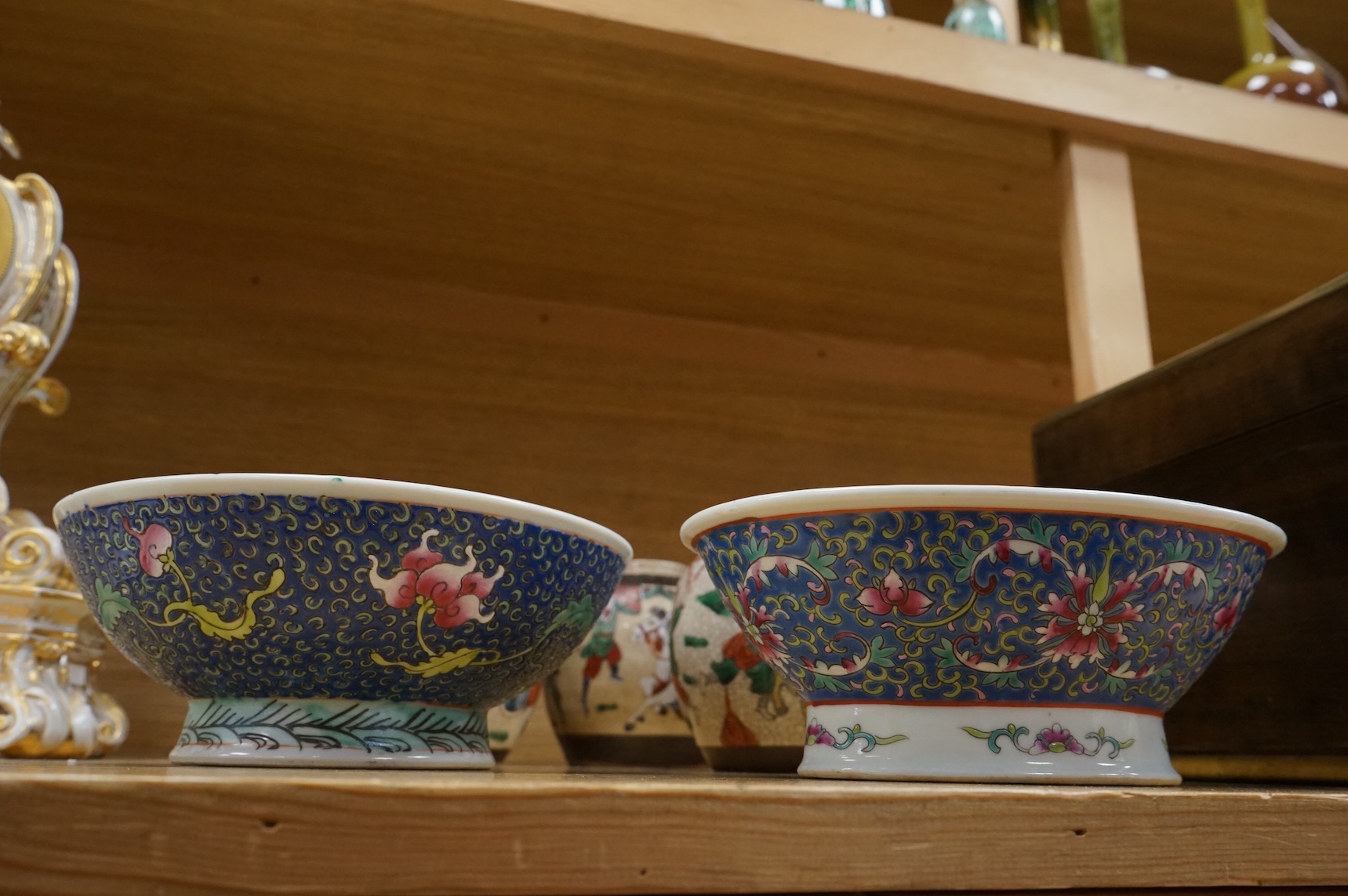 Three Chinese crackleglaze 'Warriors' jars without covers and two Chinese enamelled porcelain bowls. Largest bowl 20cm diameter.